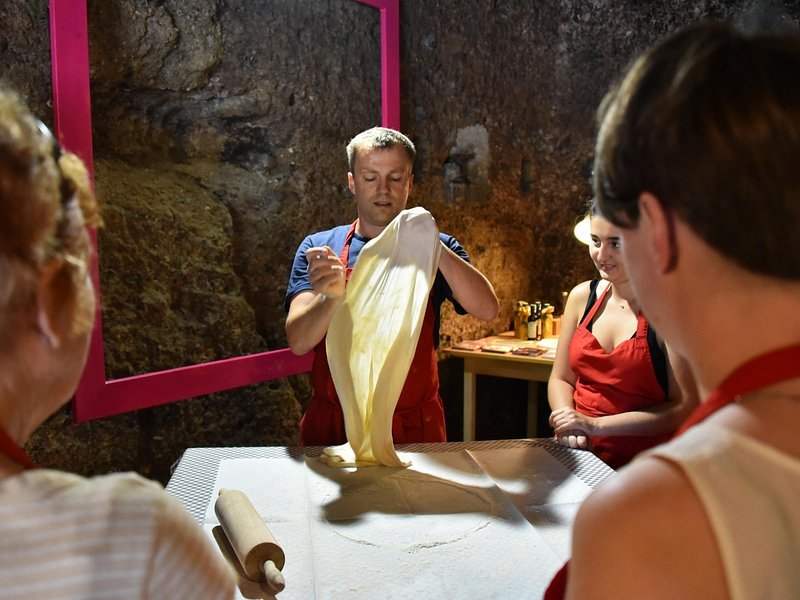 Apple strudel cooking class Vienna Austria stretching dough hands-on