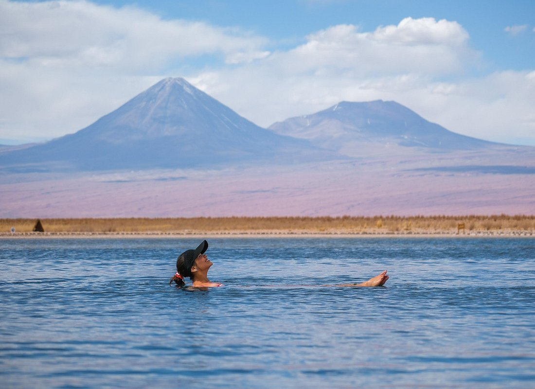 Floating in Atacama salt lagoon Chile altiplano volcanoes Licancabur