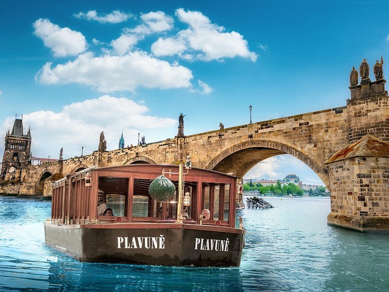 Charles Bridge Prague Czech Republic Vltava River boat baroque statues