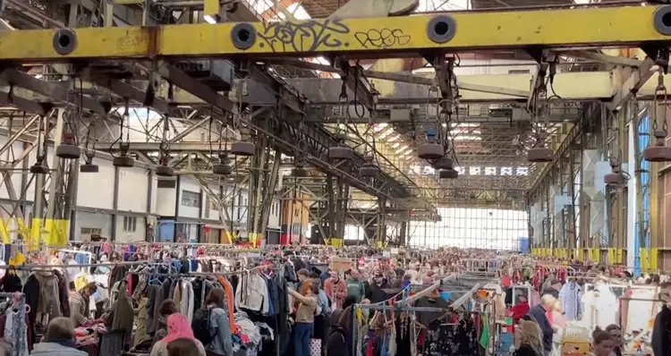 IJ-Hallen flea market Amsterdam NDSM shipyard warehouse interior stalls vintage