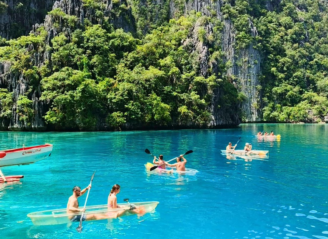 Clear kayaking Coron Palawan Philippines turquoise lagoon limestone cliffs