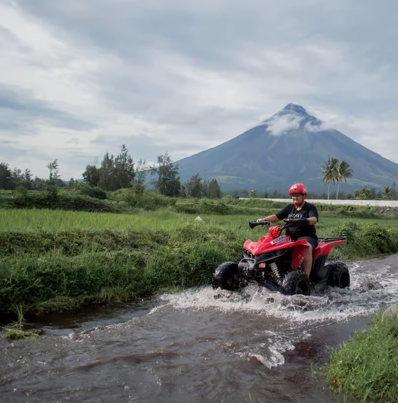 ATV around Mayon Volcano Philippines rice paddies river crossing