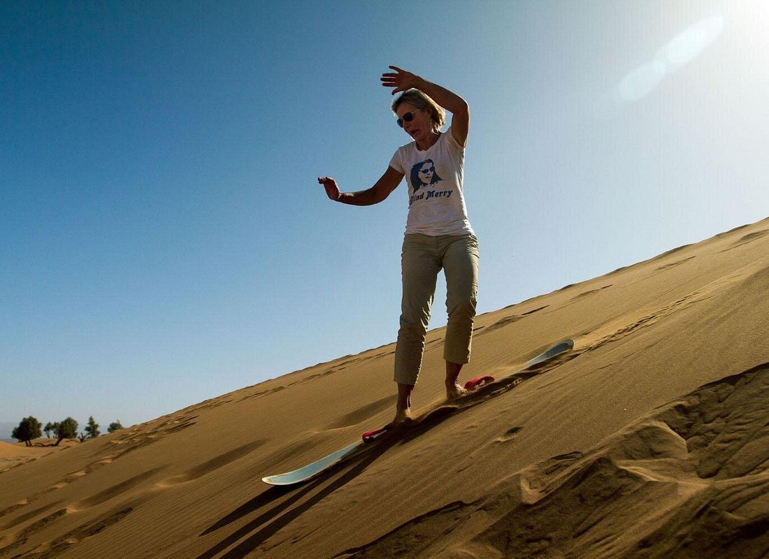 Sandboarding Sahara dunes Morocco