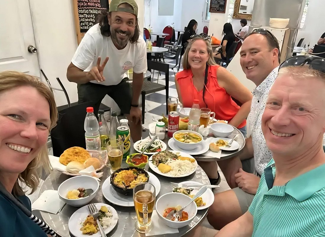 Santiago food tour Chile Mercado Central empanada pisco sour friends eating