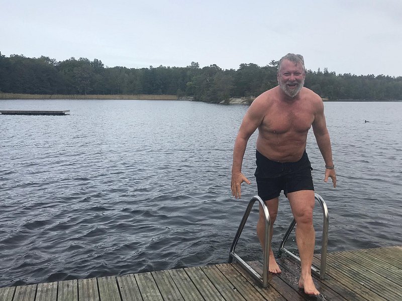 Finnish sauna lake plunge winter ice cold water Nordic ritual