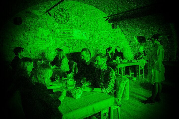 Wine tasting in the dark Bratislava medieval cellar green light