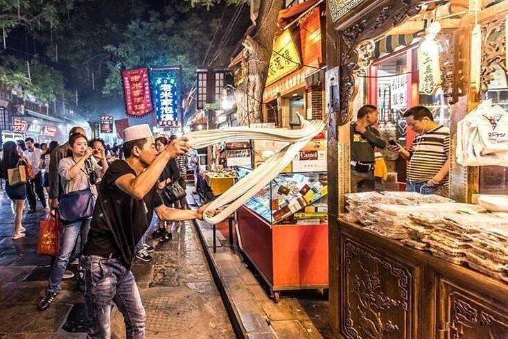 Xi'an Muslim Street food tour lantern lit alleys hand-pulled noodles China