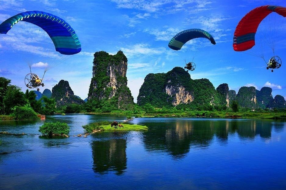 Yangshuo parasailing karst towers Li River Guilin China